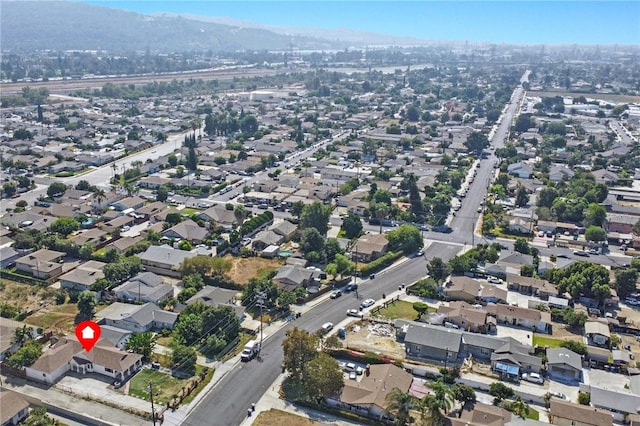 birds eye view of property featuring a mountain view