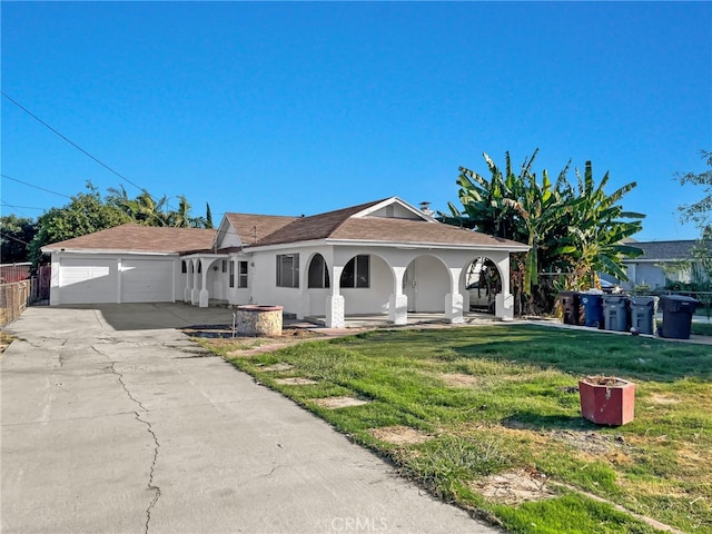 ranch-style home featuring a front yard and a garage