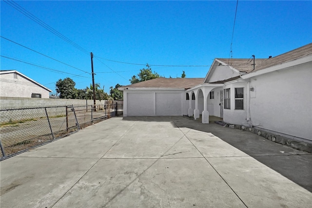 view of property exterior featuring a garage