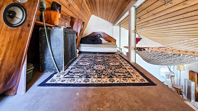 interior space with wood ceiling and wooden walls