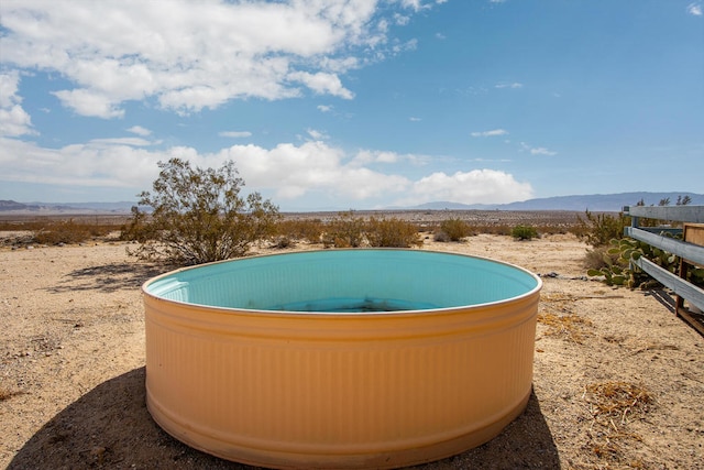 view of swimming pool featuring a mountain view