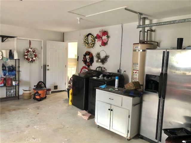 garage featuring stainless steel fridge and gas water heater