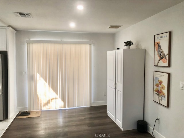 interior space with dark wood-type flooring