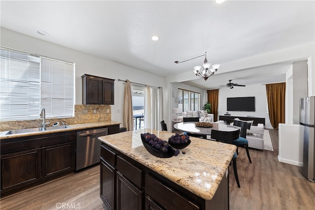 kitchen featuring light hardwood / wood-style flooring, sink, a center island, and dishwasher