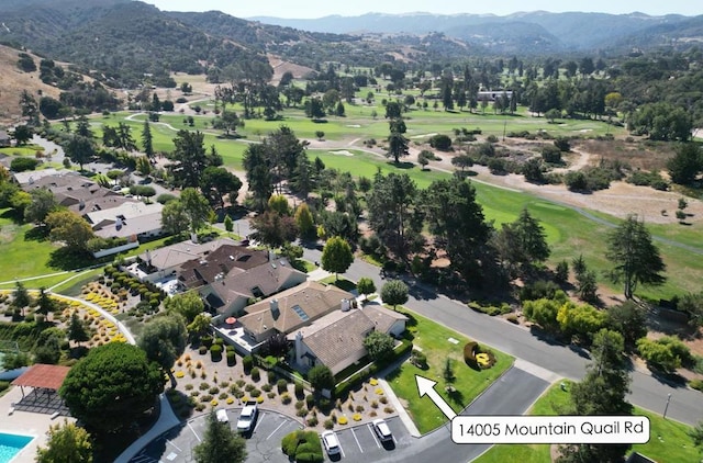 birds eye view of property with a mountain view