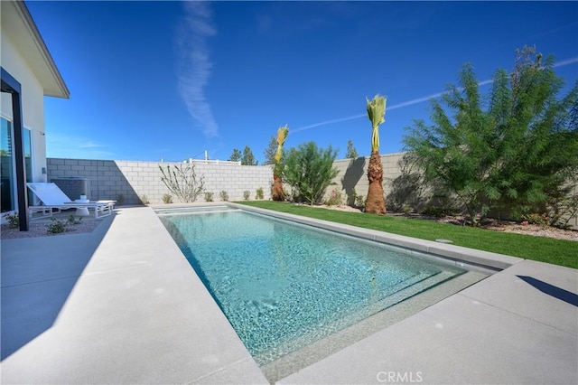 view of swimming pool featuring a patio and central AC unit