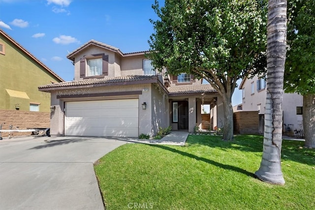 view of front of property with a front yard and a garage