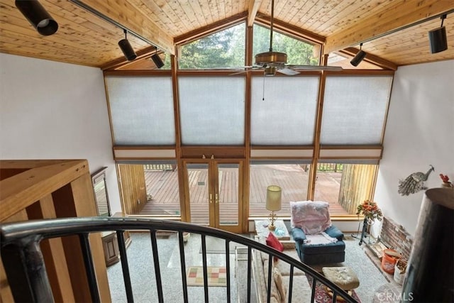 interior space with wood ceiling, ceiling fan, and beamed ceiling