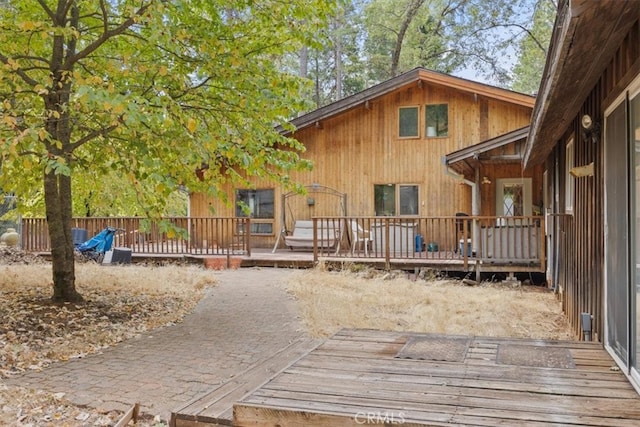 rear view of house with a deck