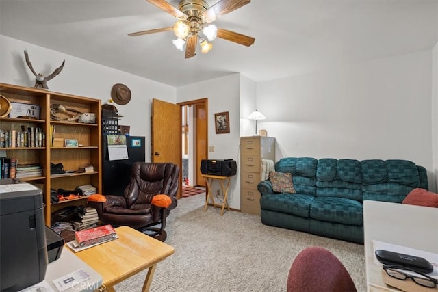 interior space with ceiling fan and light colored carpet