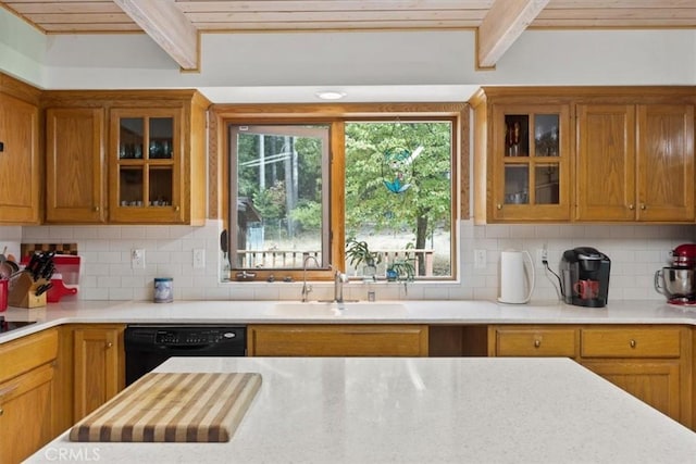 kitchen featuring a sink, brown cabinets, wood ceiling, beamed ceiling, and light countertops