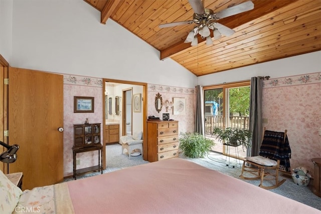 unfurnished bedroom featuring access to outside, ceiling fan, beamed ceiling, carpet floors, and ensuite bath