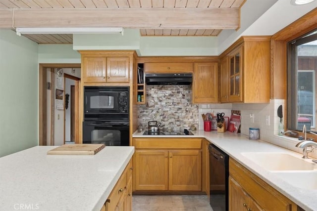 kitchen featuring black appliances, wooden ceiling, under cabinet range hood, and beam ceiling