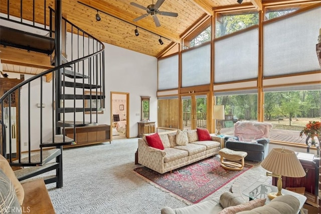 living room with carpet, ceiling fan, wooden ceiling, beam ceiling, and high vaulted ceiling