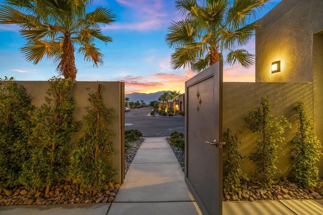 view of gate at dusk