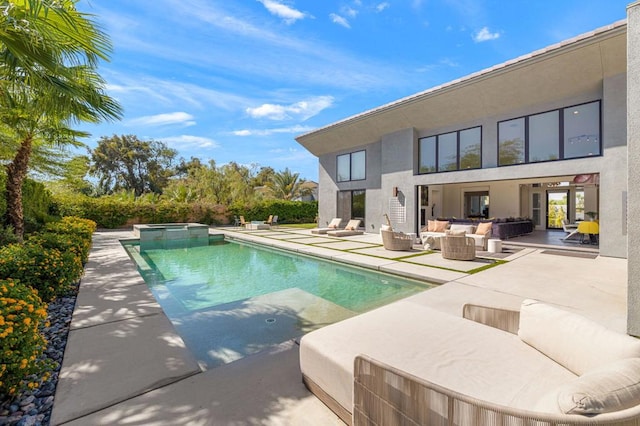 view of pool with an outdoor living space with a fire pit, a patio, and an in ground hot tub