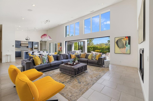 tiled living room with a high ceiling