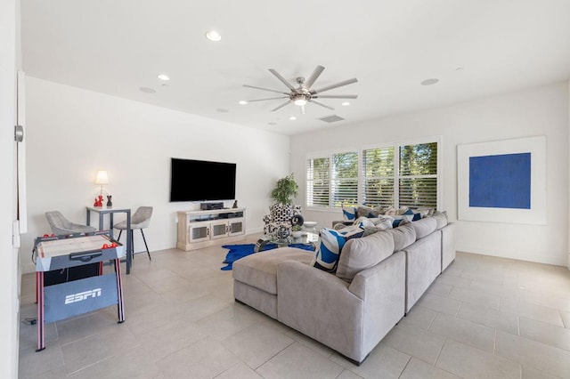 tiled living room featuring ceiling fan