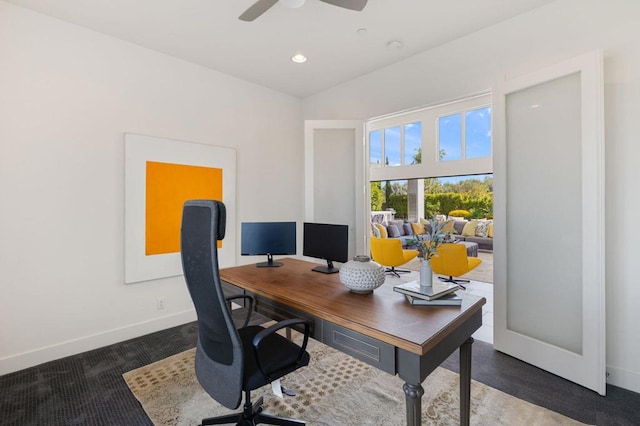 office featuring ceiling fan and dark colored carpet