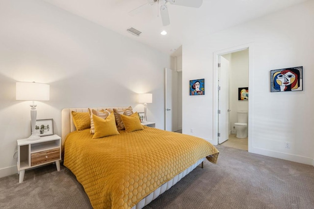 carpeted bedroom with ceiling fan and ensuite bath