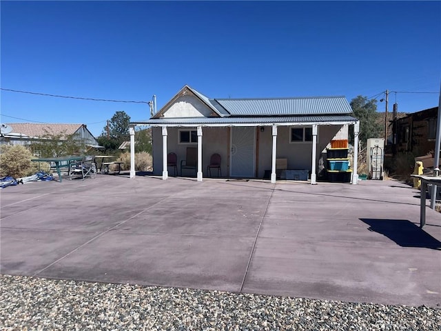 rear view of house featuring a patio