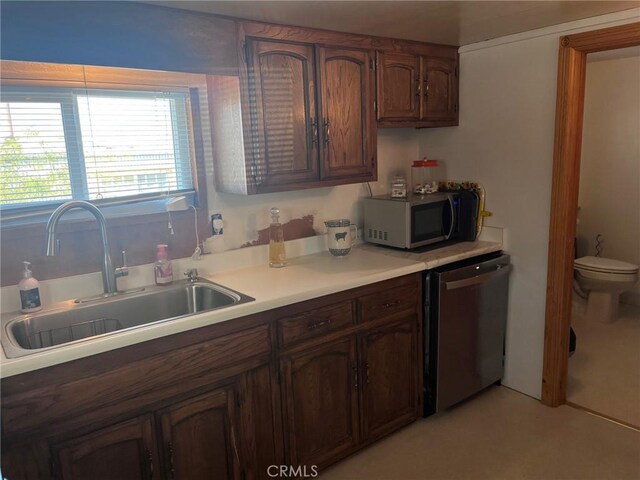 kitchen with sink and appliances with stainless steel finishes