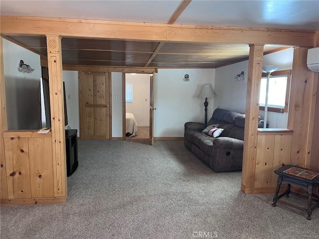 basement featuring carpet and an AC wall unit