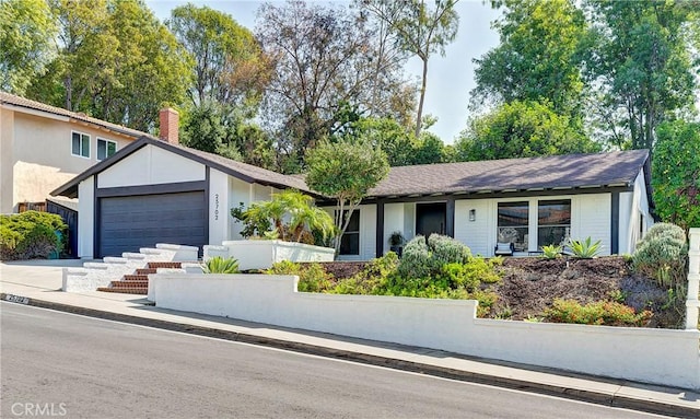 single story home with a garage