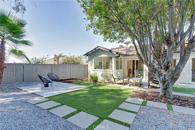 exterior space featuring a lawn and a patio