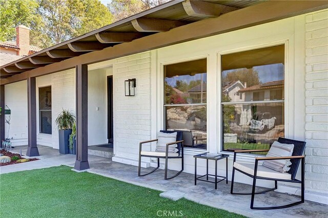 property entrance featuring covered porch