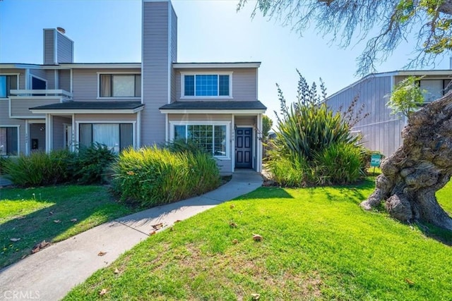 view of property with a front lawn