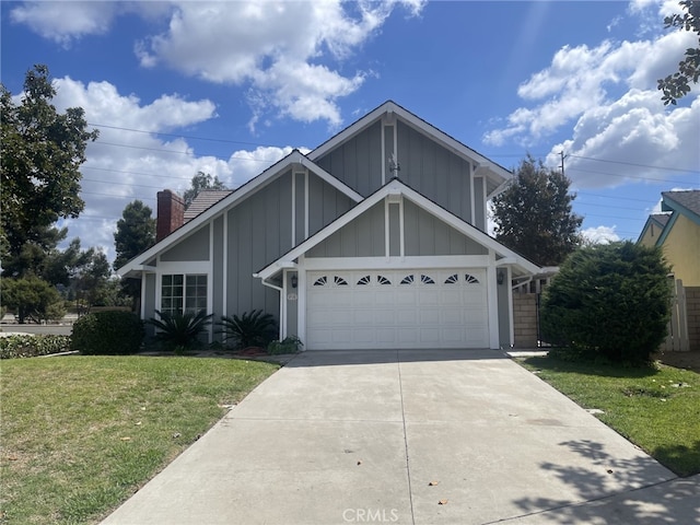 view of front of home featuring a garage and a front yard