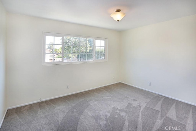 unfurnished room featuring carpet floors