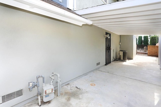 view of patio / terrace featuring a carport and central AC unit