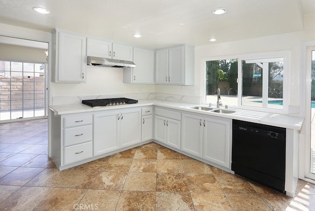 kitchen featuring white cabinets, sink, and black appliances