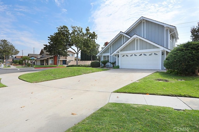 view of front of house with a front yard and a garage