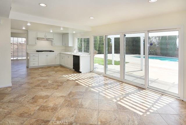 kitchen with white cabinets, a healthy amount of sunlight, sink, and black appliances