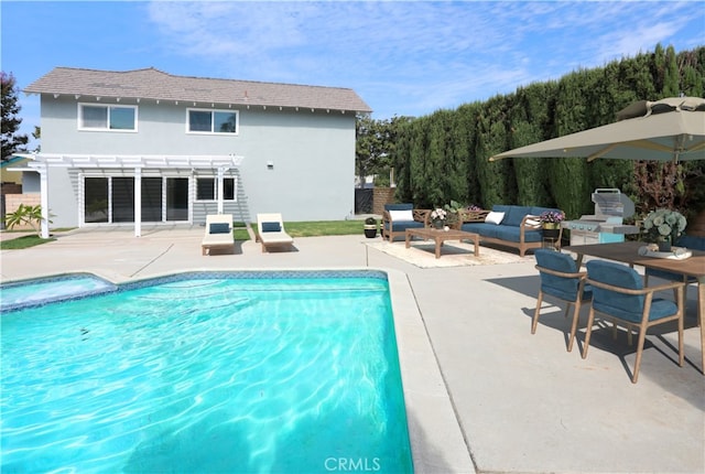 view of swimming pool featuring a pergola, area for grilling, and a patio