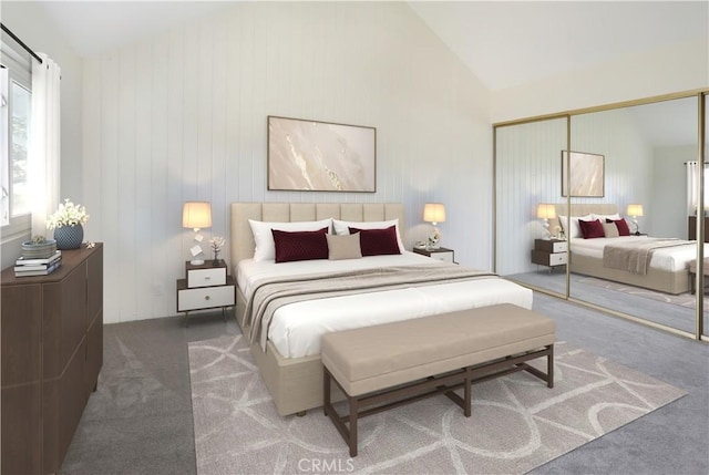 carpeted bedroom featuring a closet and lofted ceiling