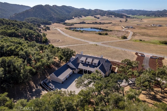 birds eye view of property with a mountain view