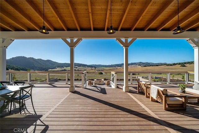 wooden terrace featuring a mountain view