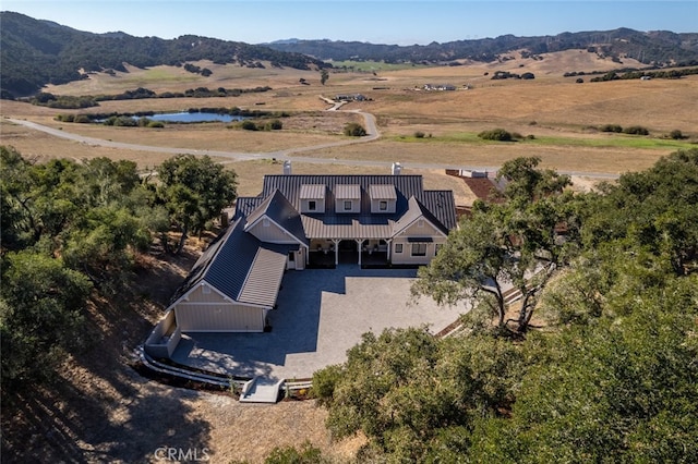 drone / aerial view with a mountain view and a rural view