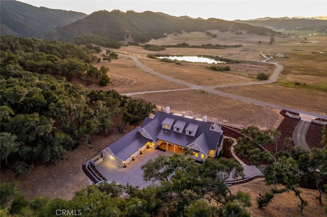 birds eye view of property with a mountain view