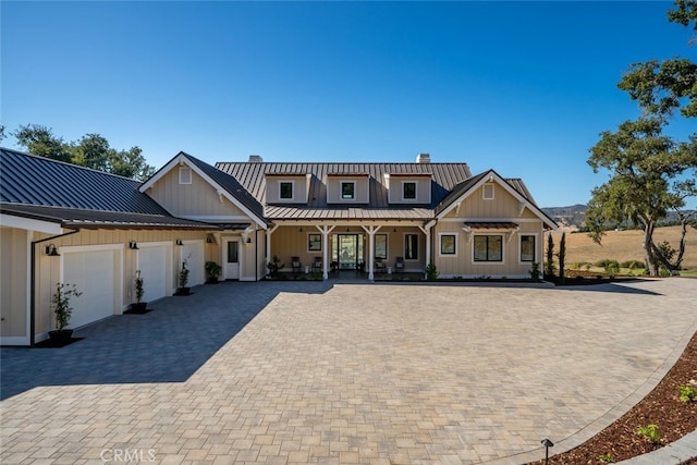 view of front of property with a garage and a porch