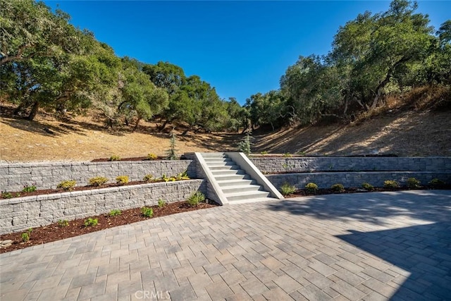 view of patio / terrace featuring stairway