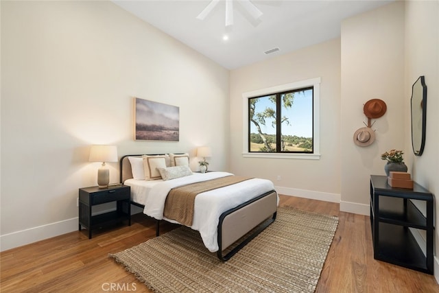 bedroom featuring hardwood / wood-style floors and ceiling fan