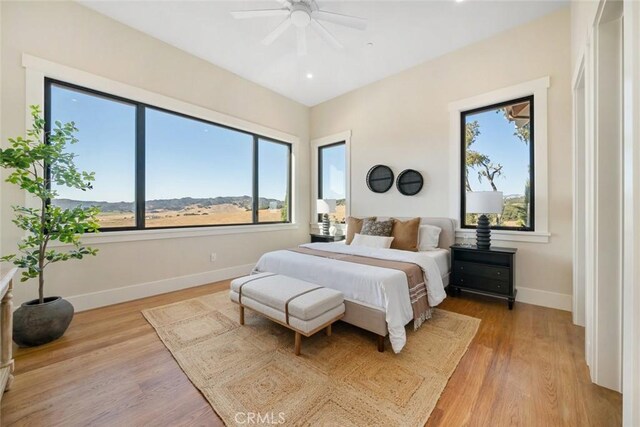 bedroom featuring ceiling fan, baseboards, light wood-style flooring, and recessed lighting