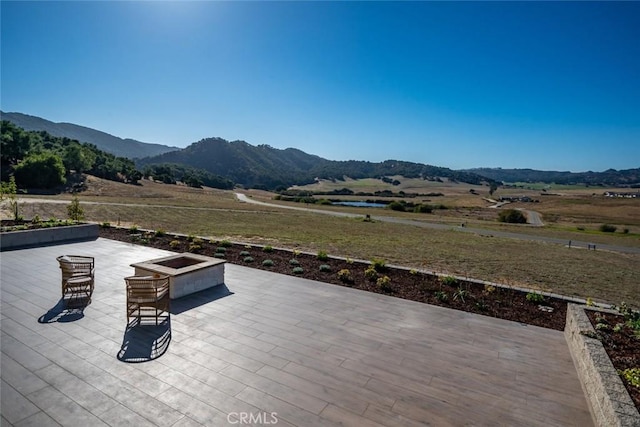 exterior space with a rural view and a mountain view