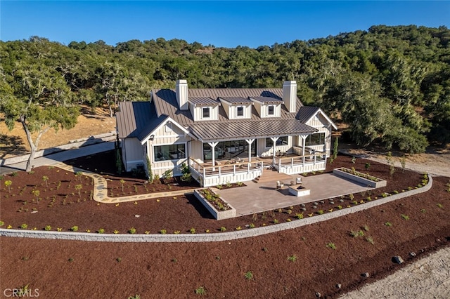 view of front of property featuring a patio and a porch