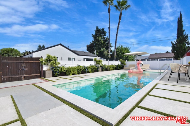 view of swimming pool featuring a patio